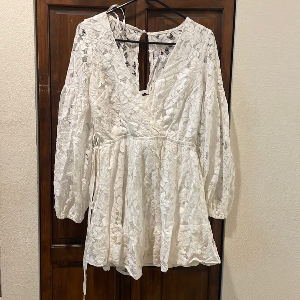 A short white dress from here comes the sun